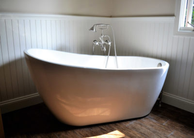 A freestanding tub in a new bathroom remodel by Precision Contracting in Thornton, PA